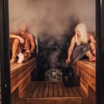 Couple doing sauna — Go East Travels wellness journey