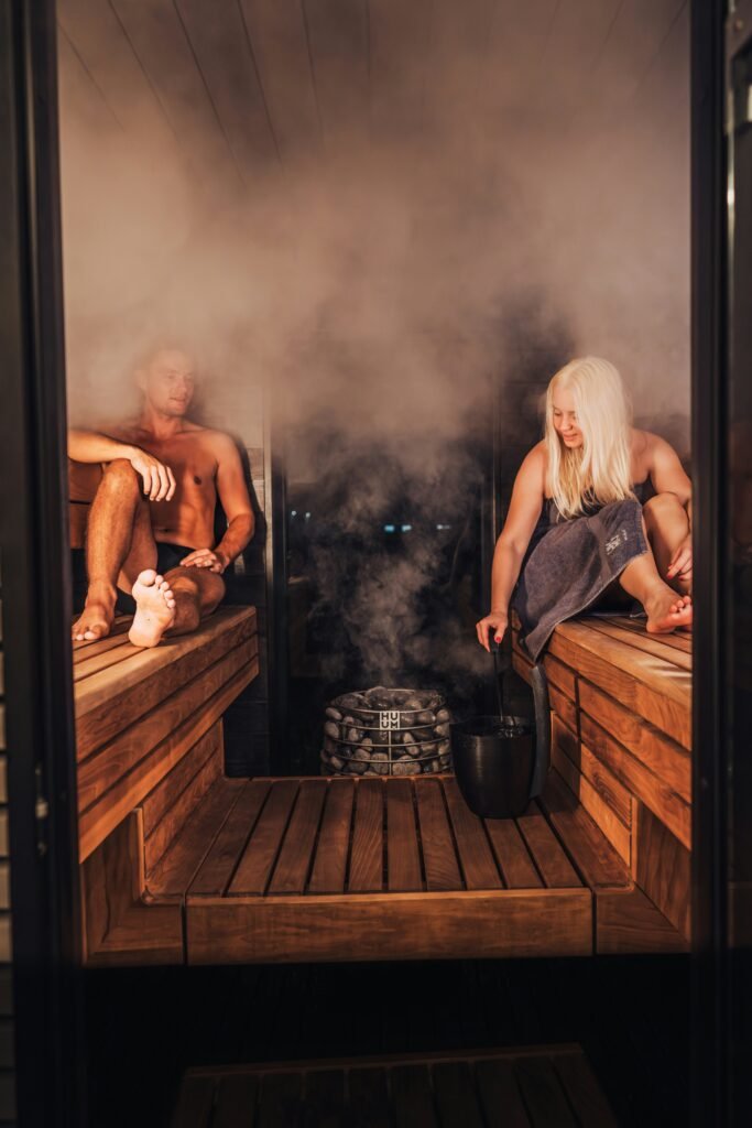 Couple doing sauna — Go East Travels wellness journey